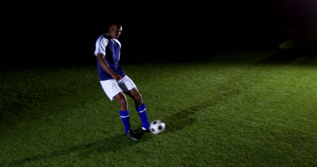 A dedicated young athlete trains for soccer at night, embodying sports commitment. - Free Images, Stock Photos and Pictures on Pikwizard.com