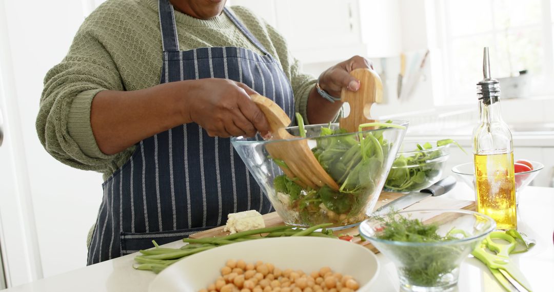 Person Preparing Healthy Salad in Modern Kitchen - Free Images, Stock Photos and Pictures on Pikwizard.com