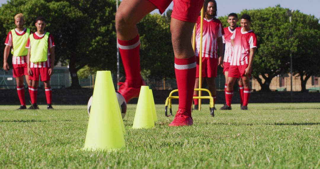 Soccer Players Training on Field with Cones and Hurdles - Free Images, Stock Photos and Pictures on Pikwizard.com