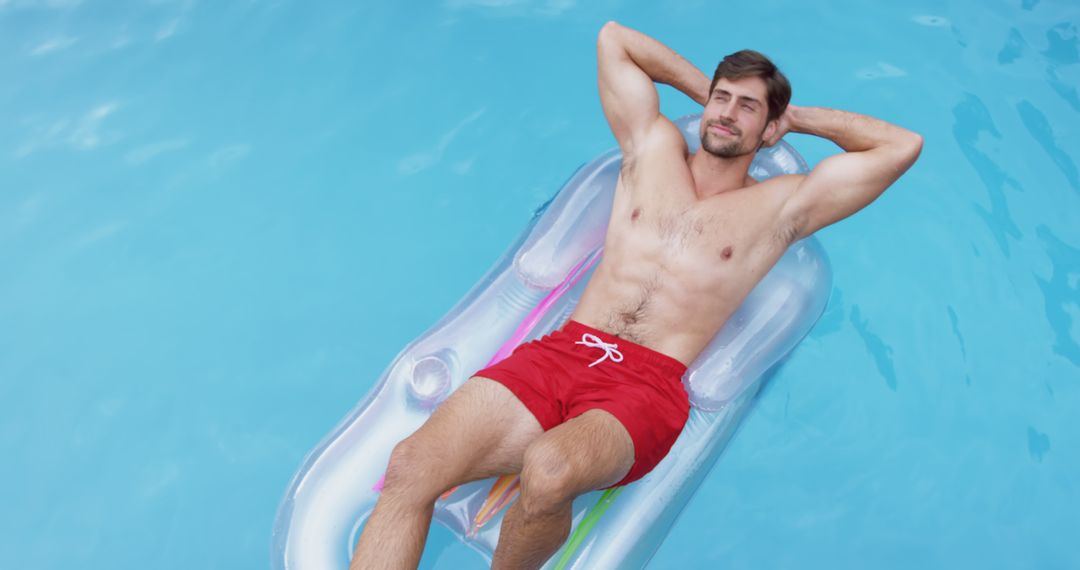 Relaxing Man Floating on Inflatable Raft in Pool - Free Images, Stock Photos and Pictures on Pikwizard.com