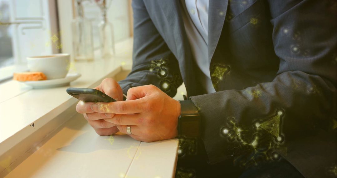 Businessman Using Smartphone with Coffee in Modern Cafe Setting