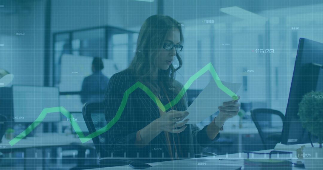 Woman Reviewing Financial Documents with Data Analytics Overlay in Modern Office