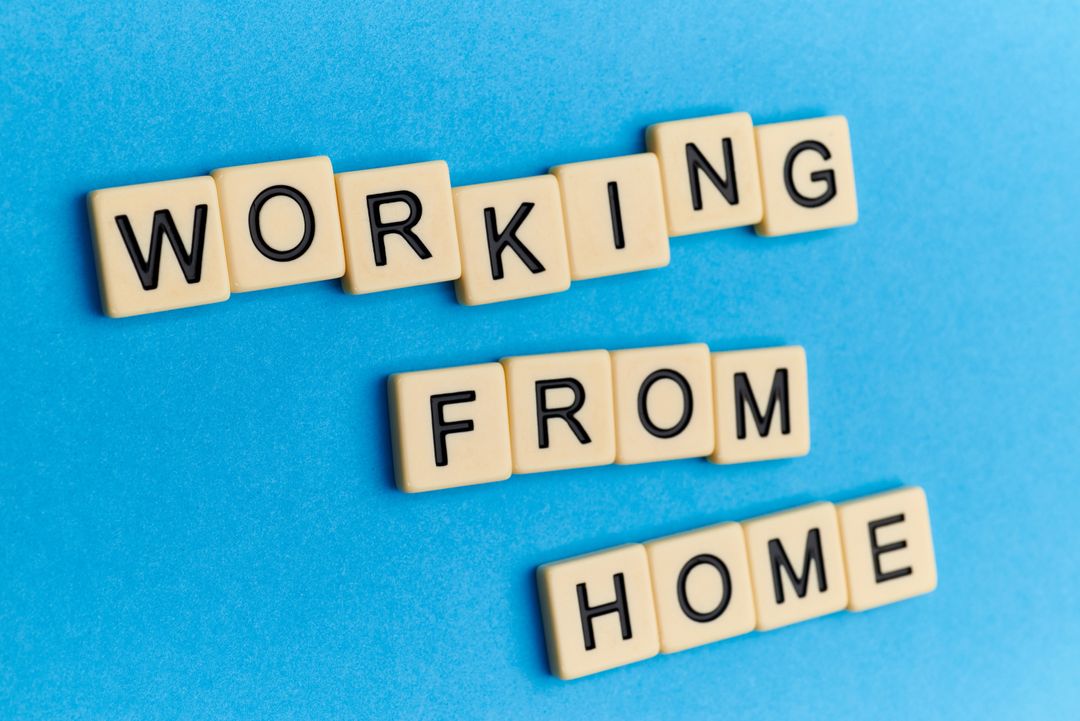 Working from Home Concept with Text on Blue Background