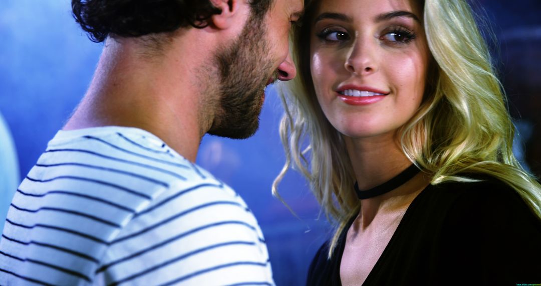 Couple Sharing Romantic Moment with Gleeful Expressions