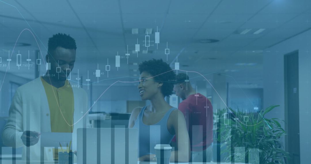 Business Team Analyzing Data in Open-Plan Office with Technology Interface