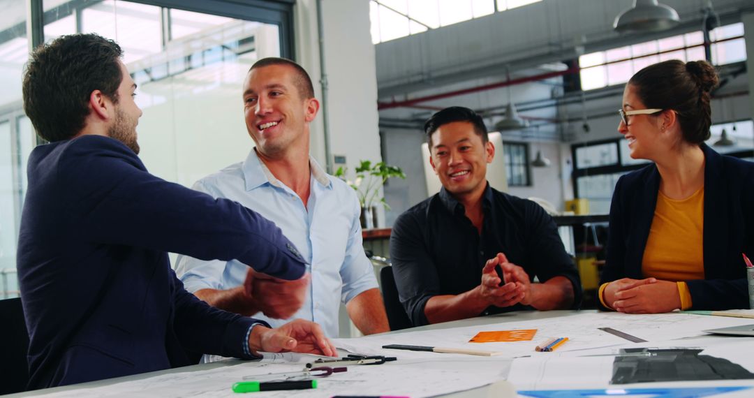 Diverse Professionals Collaborating in Creative Workspace