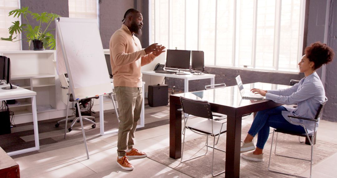 Professional Team Meeting with Successful Presentation in Bright Office