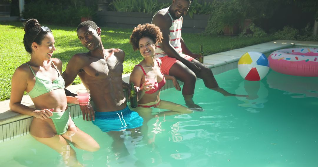 Diverse Group of Friends Enjoying Poolside Activities in Summer