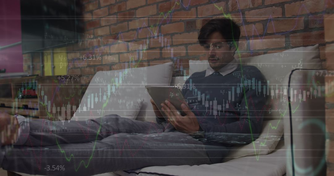 Businessman Analyzing Financial Data on Tablet at Home