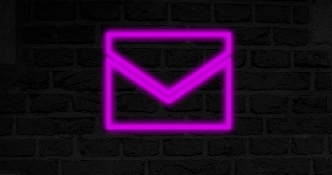 Glowing Neon Envelope on Brick Wall
