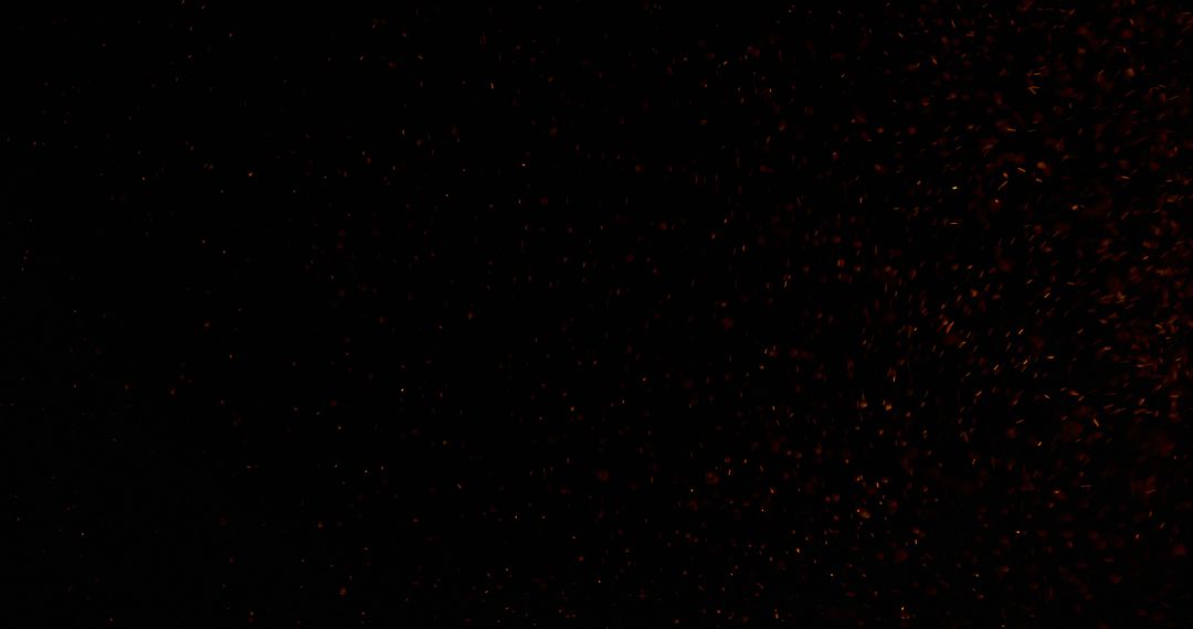A dark background with subtle red sparkles, with copy space - Free Images, Stock Photos and Pictures on Pikwizard.com