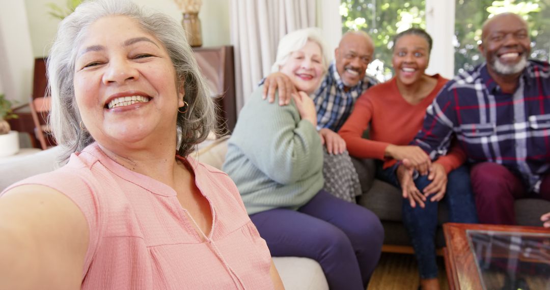 Group of Happy Seniors Enjoying Time Together in Living Room - Free Images, Stock Photos and Pictures on Pikwizard.com