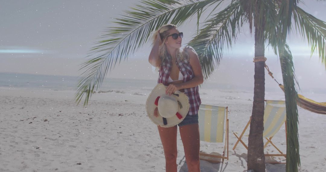 Woman on Sandy Beach Shade with Palm and Hammock
