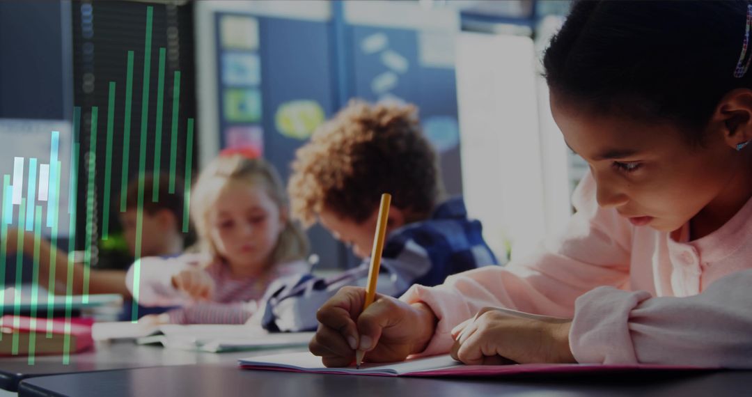 Focused schoolgirl writing in classroom, classmates studying with notebooks and pencils