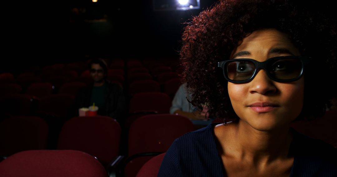 Woman Anticipating Movie Wearing 3D Glasses in Theatre - Free Images, Stock Photos and Pictures on Pikwizard.com