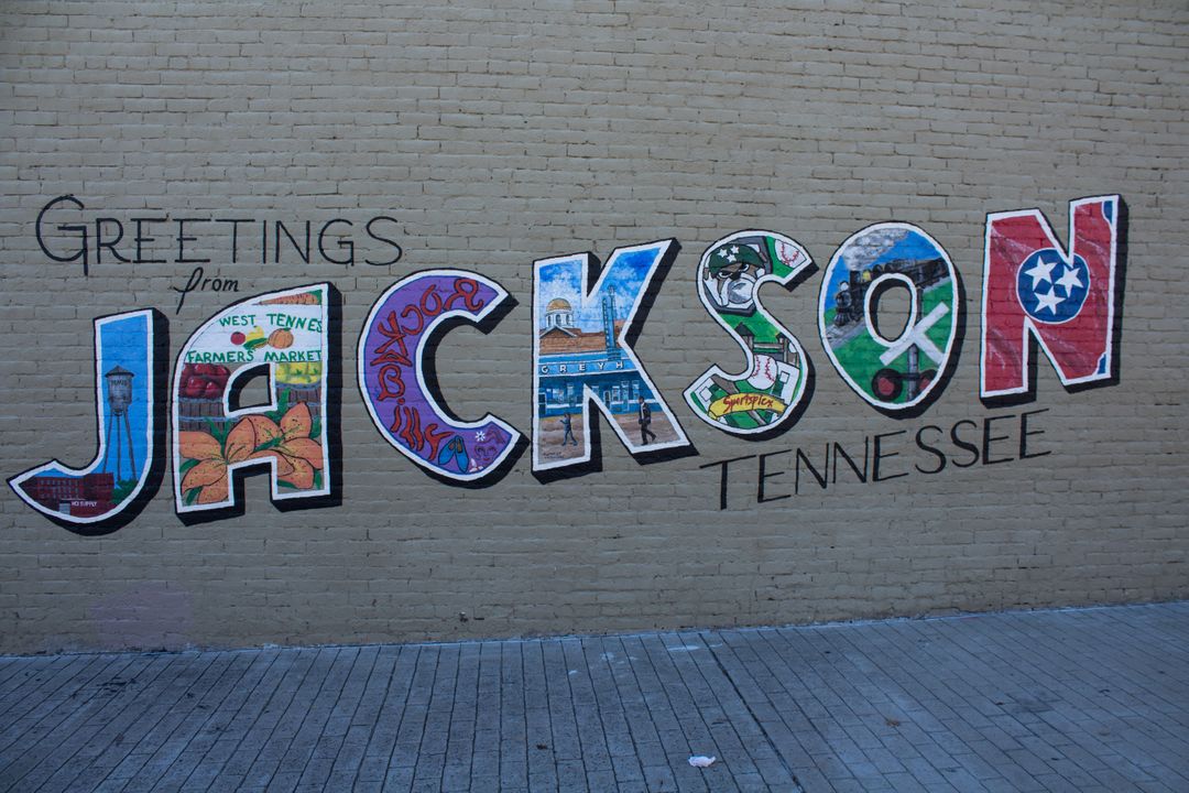 Greetings from Jackson Tennessee mural on brick wall - Free Images, Stock Photos and Pictures on Pikwizard.com