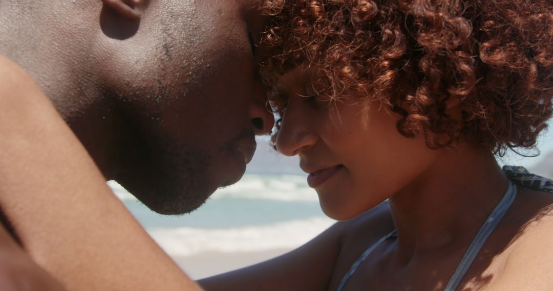 Romantic African American Couple Embracing at Beach - Free Images, Stock Photos and Pictures on Pikwizard.com