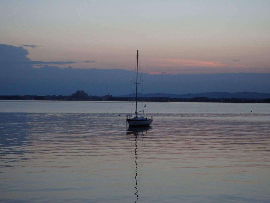 Tranquil Sailboat in Calm Waters at Twilight - Free Images, Stock Photos and Pictures on Pikwizard.com