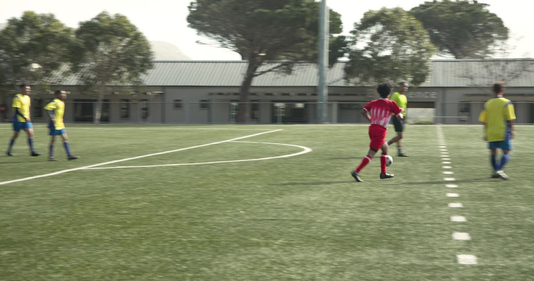 Teen Soccer Players Practicing on Field Promoting Teamwork and Unity
