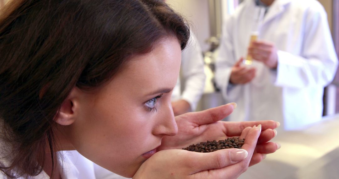 Expert Barista Smelling Fresh Coffee Beans for Quality Evaluation