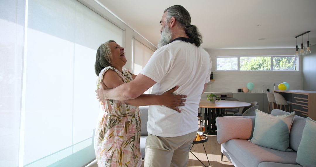 Senior Couple Enjoying Dance at Home Capturing Love and Joy
