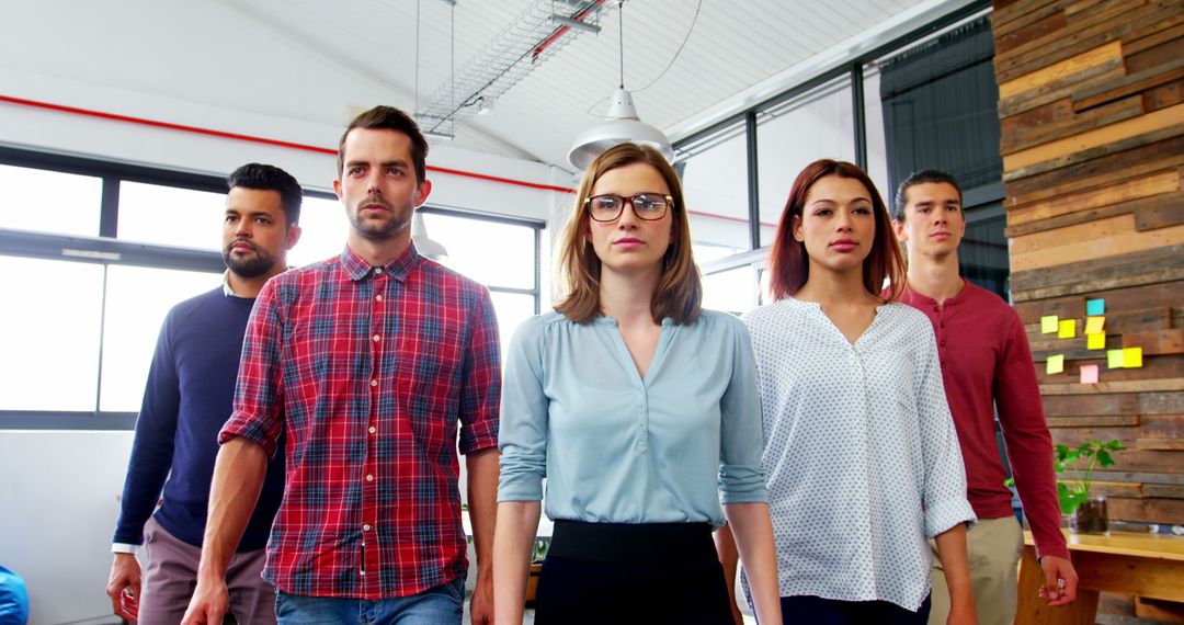 Confident Business Team Walking In Modern Office Environment