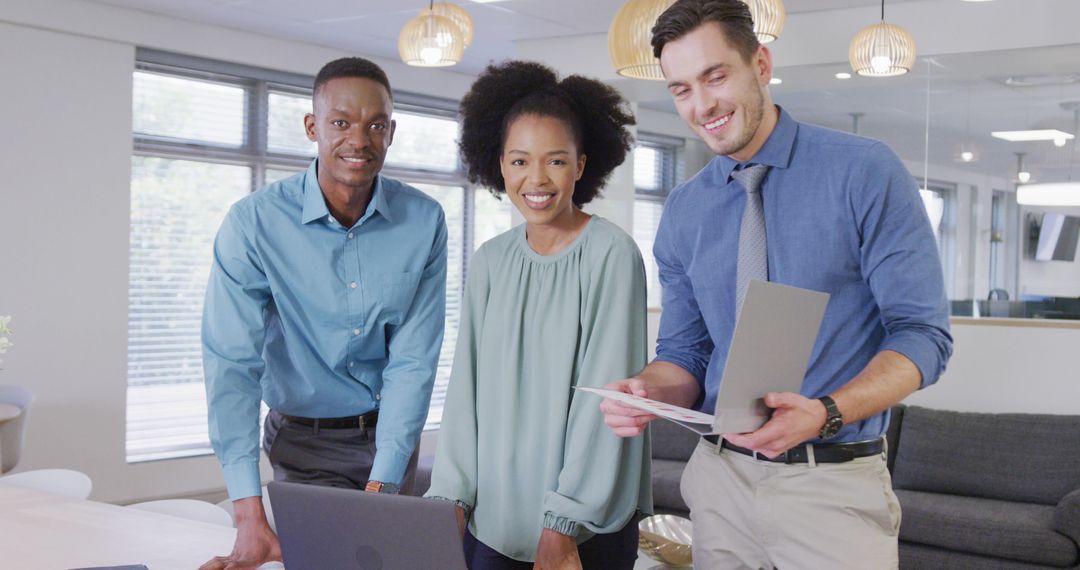 Diverse Business Team Smiling in Modern Office