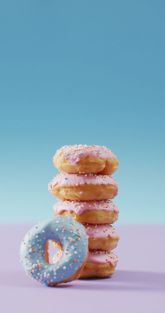 Stack of Colorful Donuts on Pastel Background - Free Images, Stock Photos and Pictures on Pikwizard.com