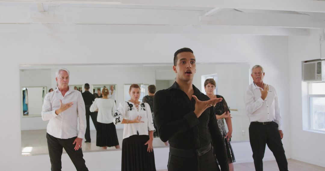 Group of Middle-Aged Adults Practicing Ballroom Dance Routine in Studio - Free Images, Stock Photos and Pictures on Pikwizard.com