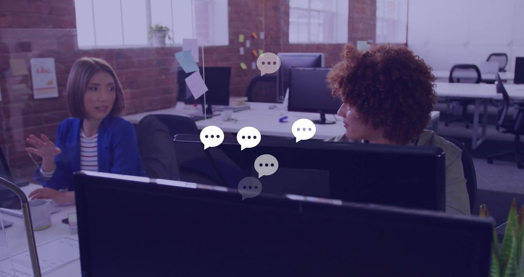 Colleagues Discussing Ideas in Modern Creative Office