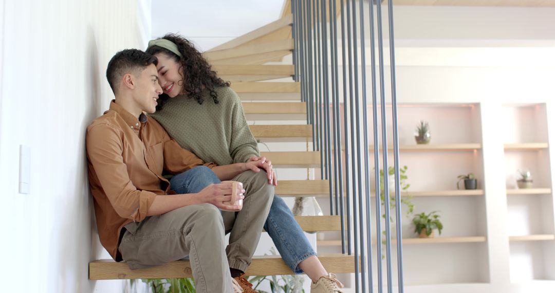 Cozy Couple Enjoying Relaxed Moment on Modern Staircase at Home