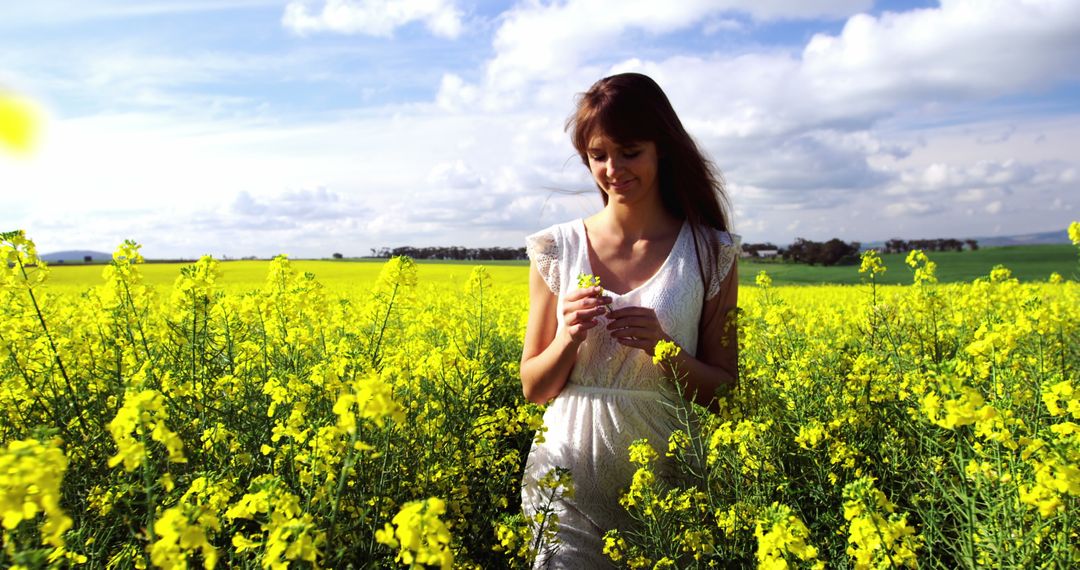 Woman Enjoying Tranquility in Vibrant Mustard Field - Free Images, Stock Photos and Pictures on Pikwizard.com