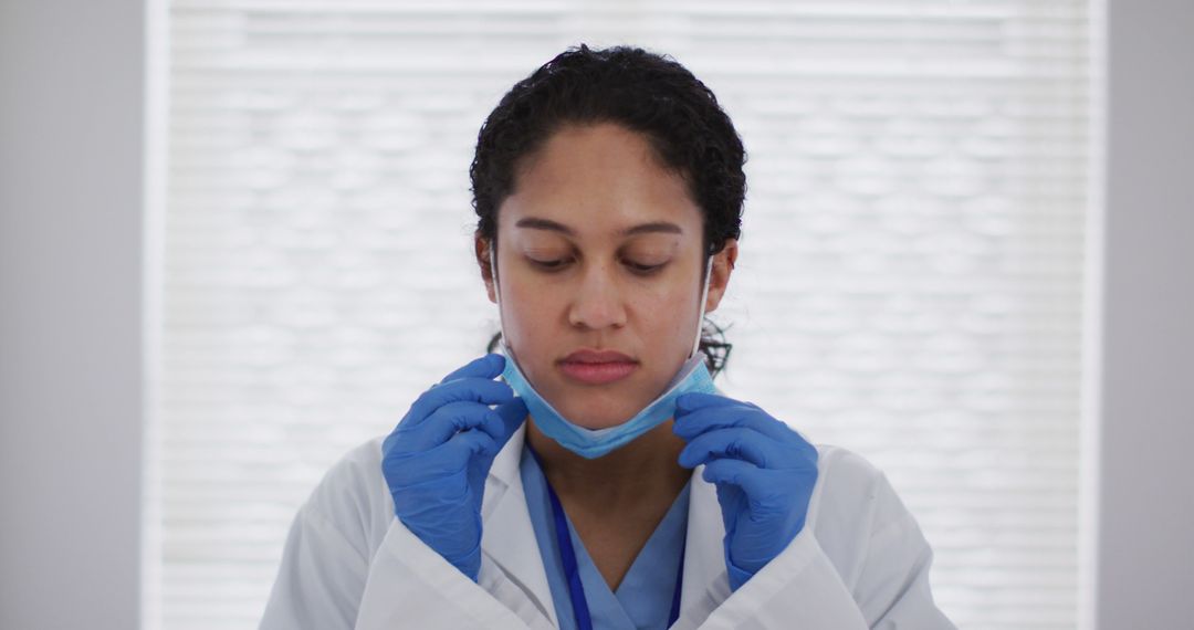 Female Doctor Removing Face Mask After Work - Free Images, Stock Photos and Pictures on Pikwizard.com