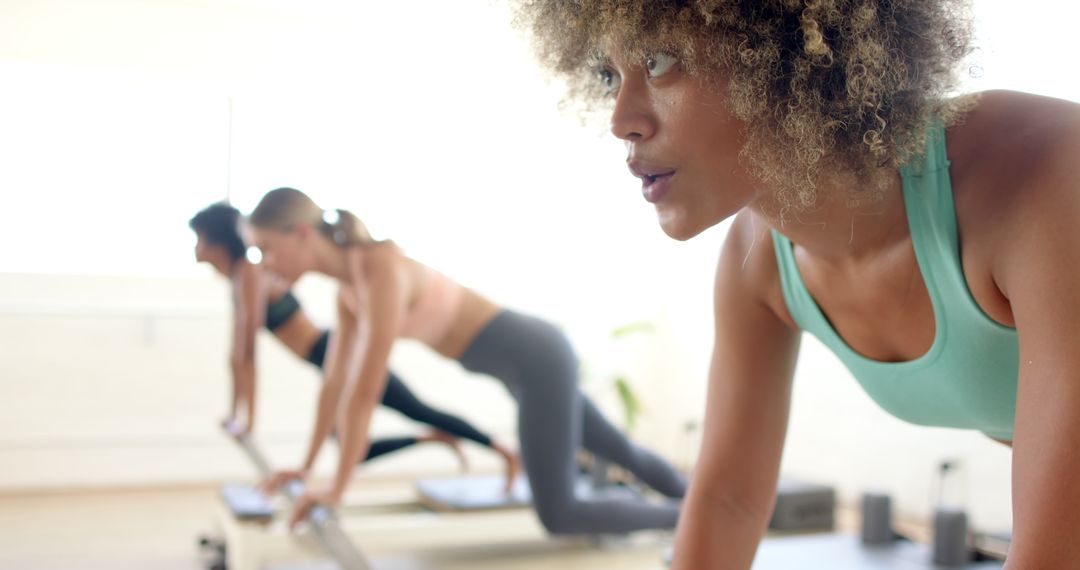 Diverse Group of Women Practicing Focused Yoga Session