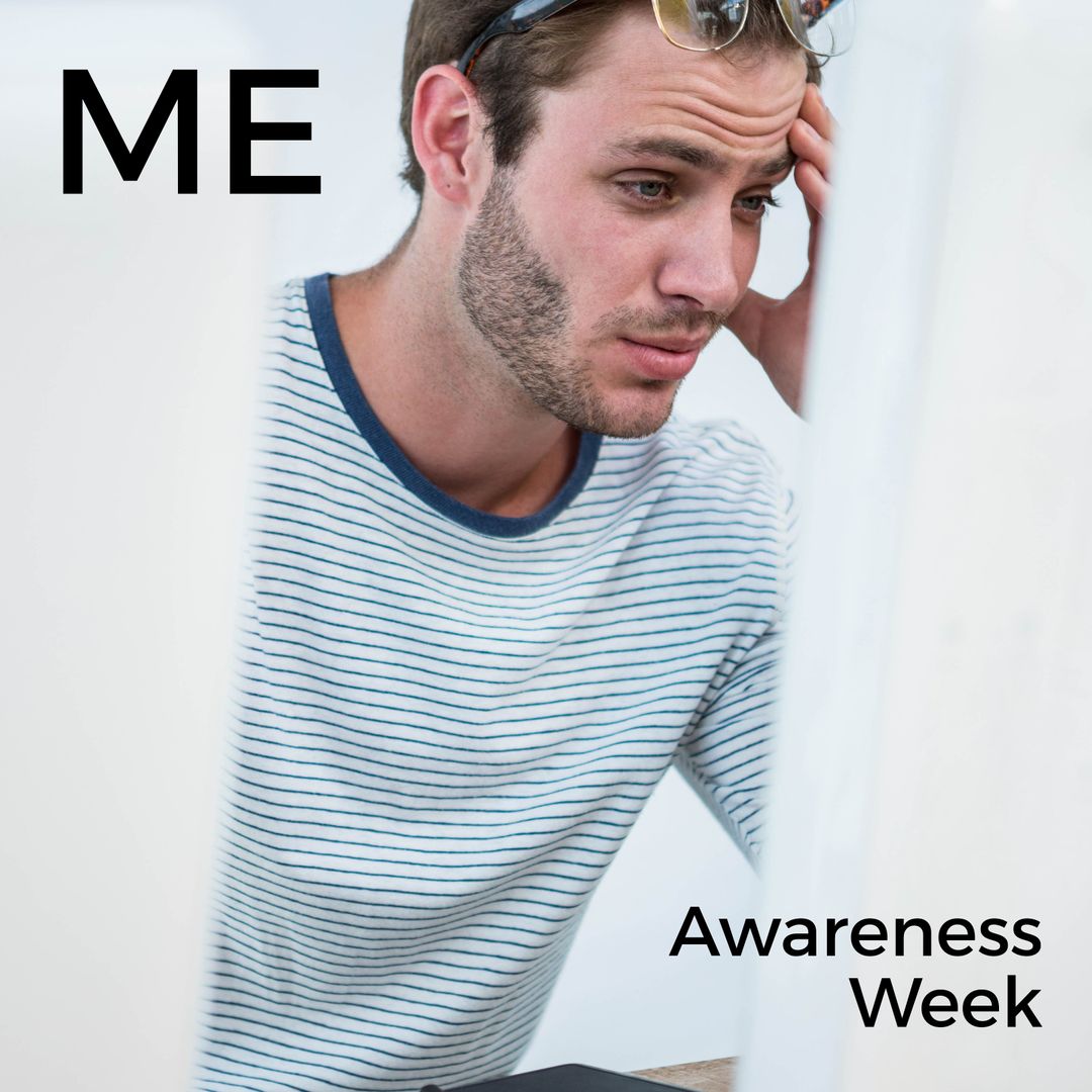 Caucasian Man Expressing Stress at Desk for Awareness Campaign