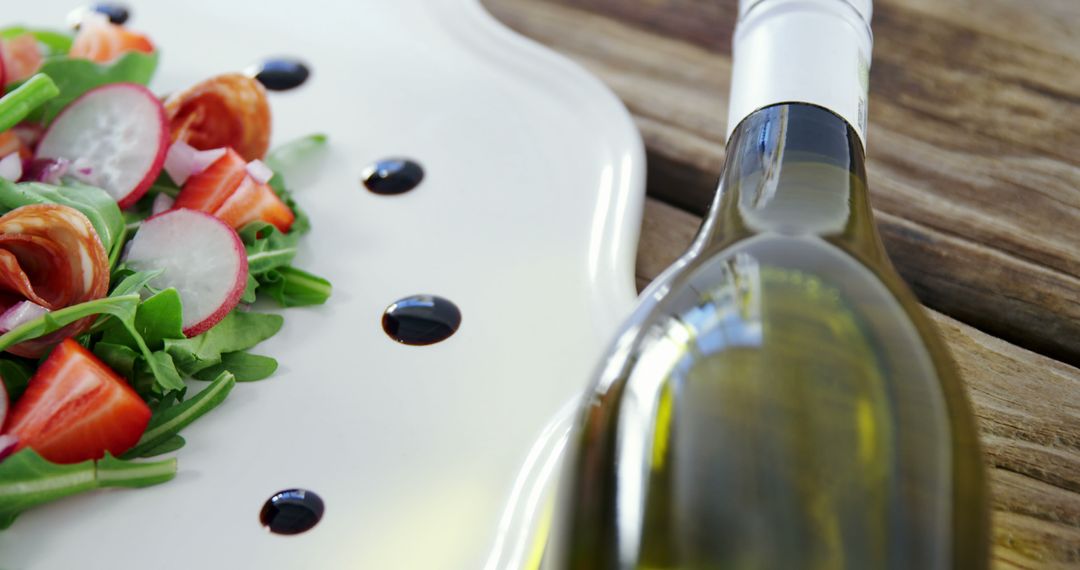 Gourmet Salad and White Wine on Rustic Table