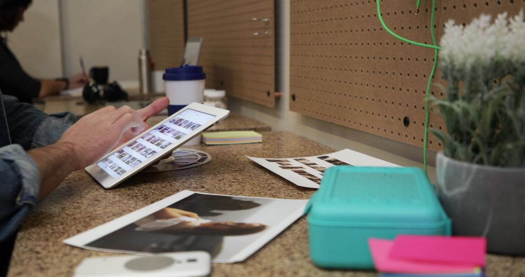Creative Male Using Tablet in Casual Workspace
