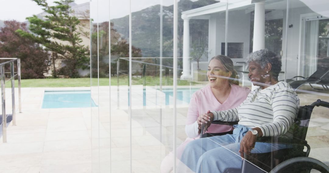 Caregiver Assisting Senior Woman in Wheelchair Outdoors - Free Images, Stock Photos and Pictures on Pikwizard.com