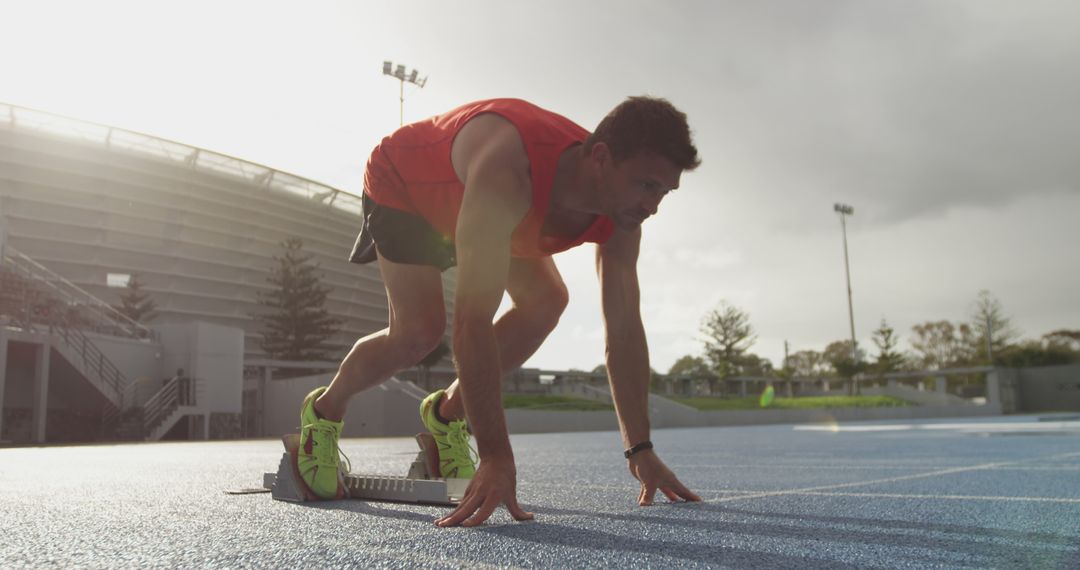 Dedicated Track Runner Preparing for Race Start on Sunny Day