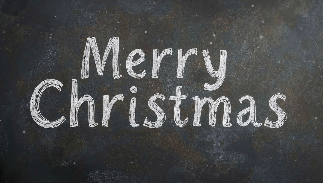 Merry Christmas Chalk Lettering on Rustic Blackboard Showing Chalk Dust and Texture