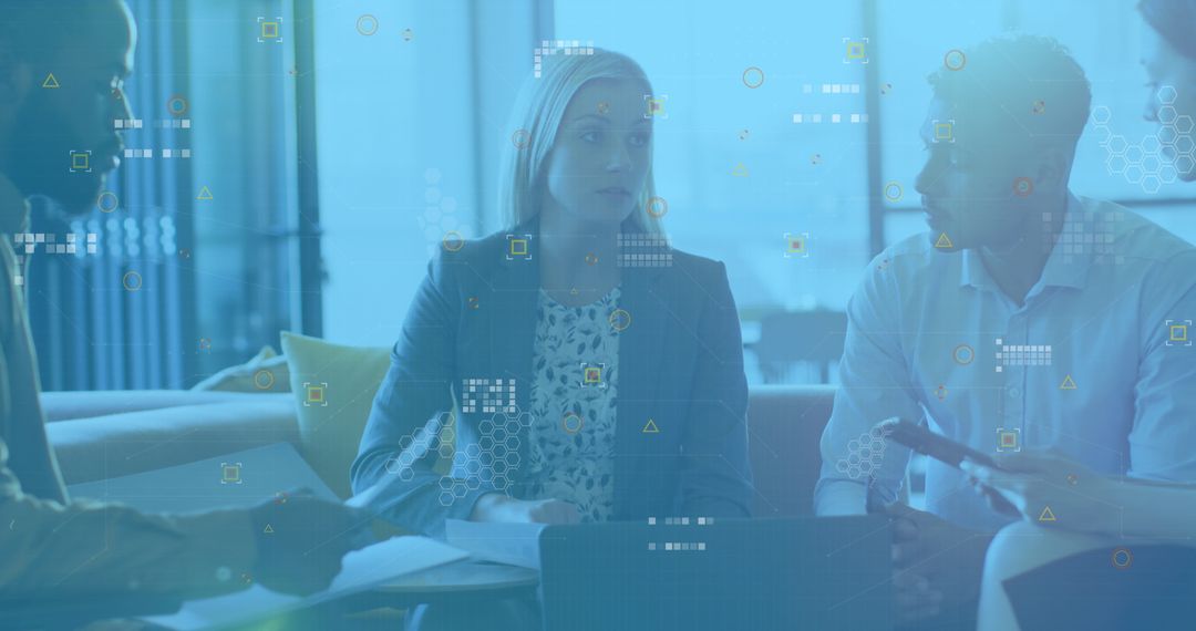 Diverse Business Team Discussing Papers in Modern Office