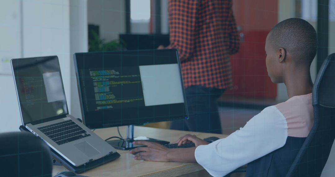 Focused Software Development Team Collaborating in Office