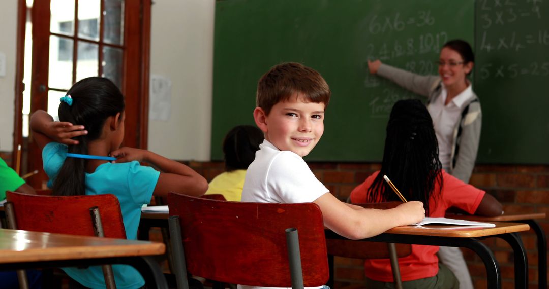 Smiling Boy in Classroom During Math Lesson - Free Images, Stock Photos and Pictures on Pikwizard.com