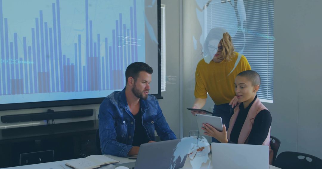 Professionals Collaborating on Data Analysis in Modern Corporate Setting