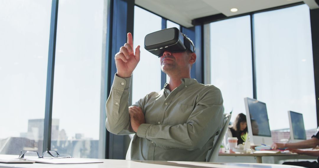 Businessman Exploring Virtual Reality Technology in Modern Office - Free Images, Stock Photos and Pictures on Pikwizard.com