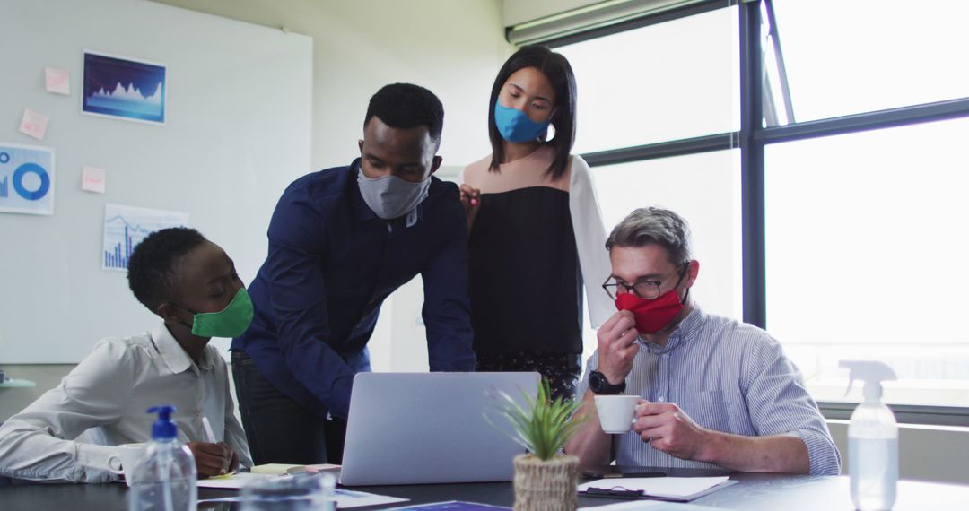 Diverse Team Collaborating in Office with Face Masks - Free Images, Stock Photos and Pictures on Pikwizard.com