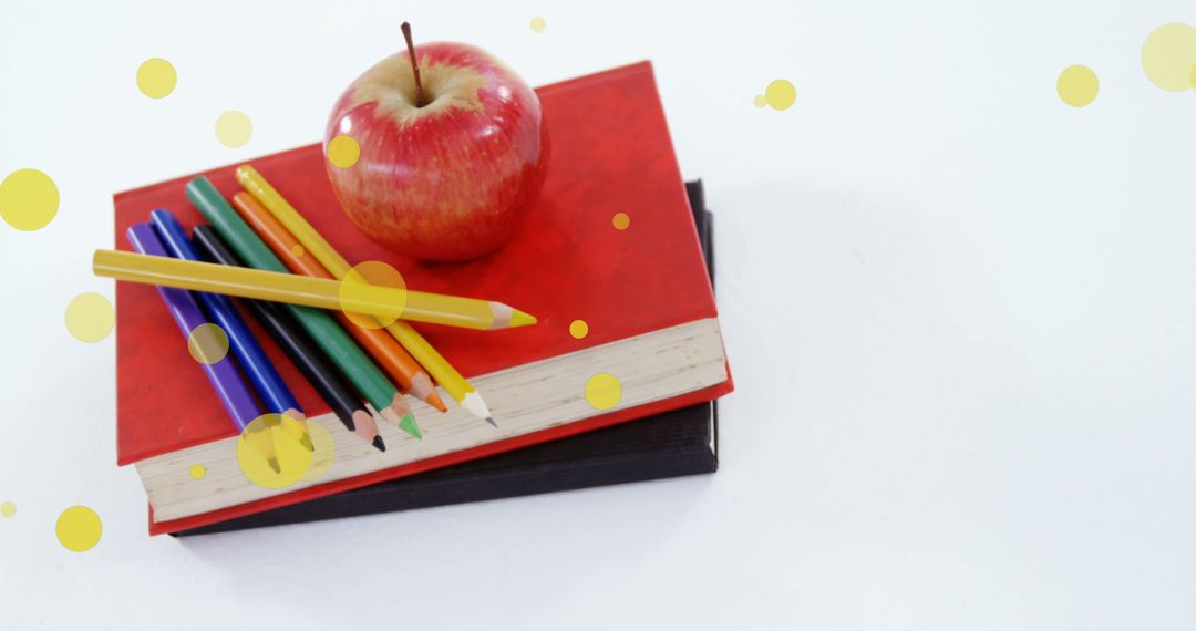 Apple and Colorful Pencils on Books for Literacy Day Concept