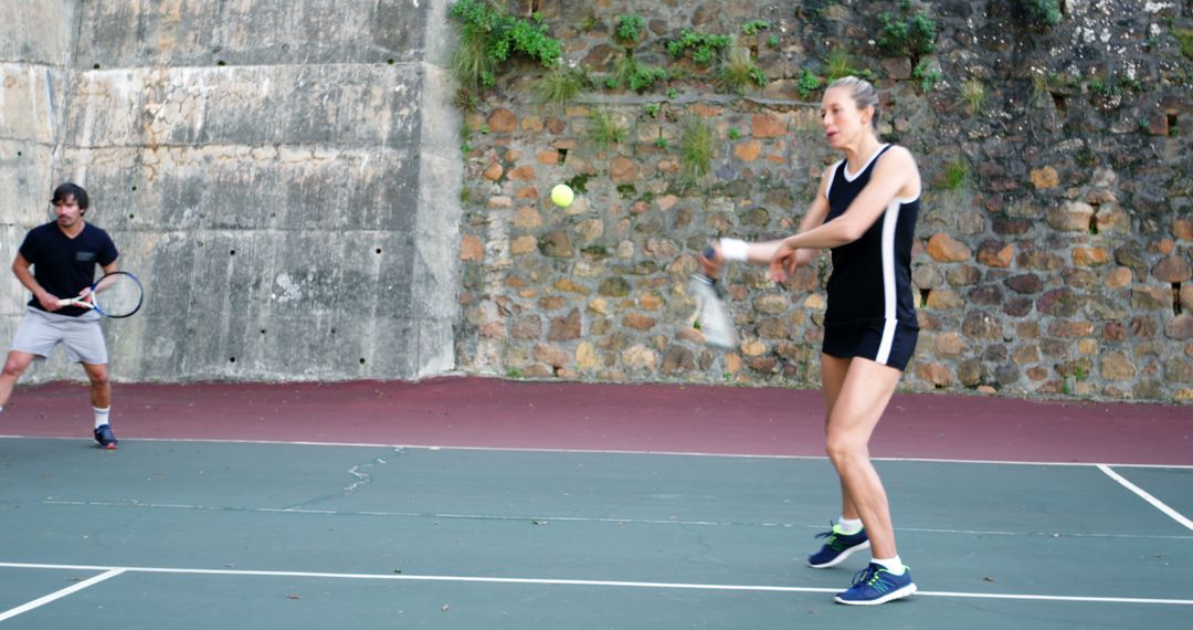 Mixed Doubles Match on Outdoor Tennis Court - Free Images, Stock Photos and Pictures on Pikwizard.com