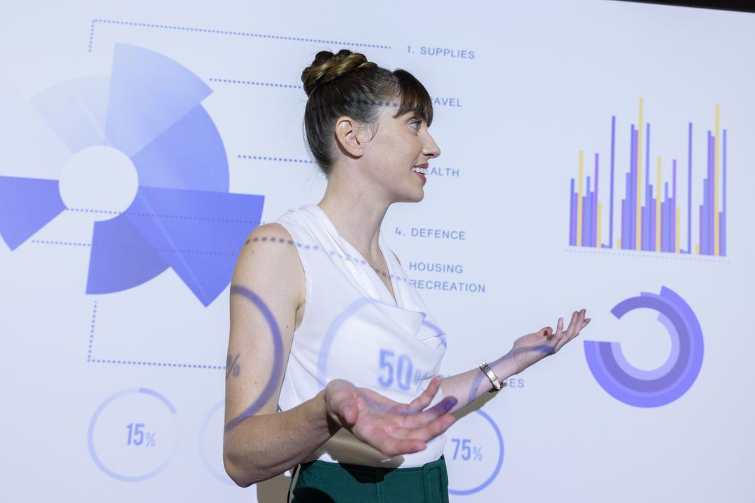 Professional Businesswoman Presenting Data with Charts