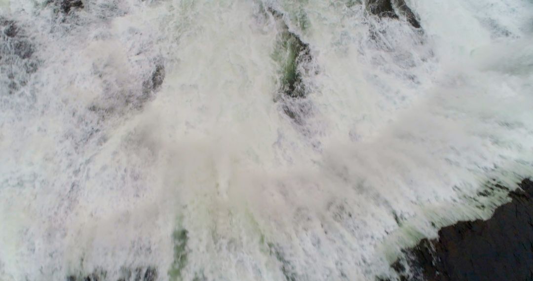 Top View of Powerful Waterfall with Raging Water Flow - Free Images, Stock Photos and Pictures on Pikwizard.com